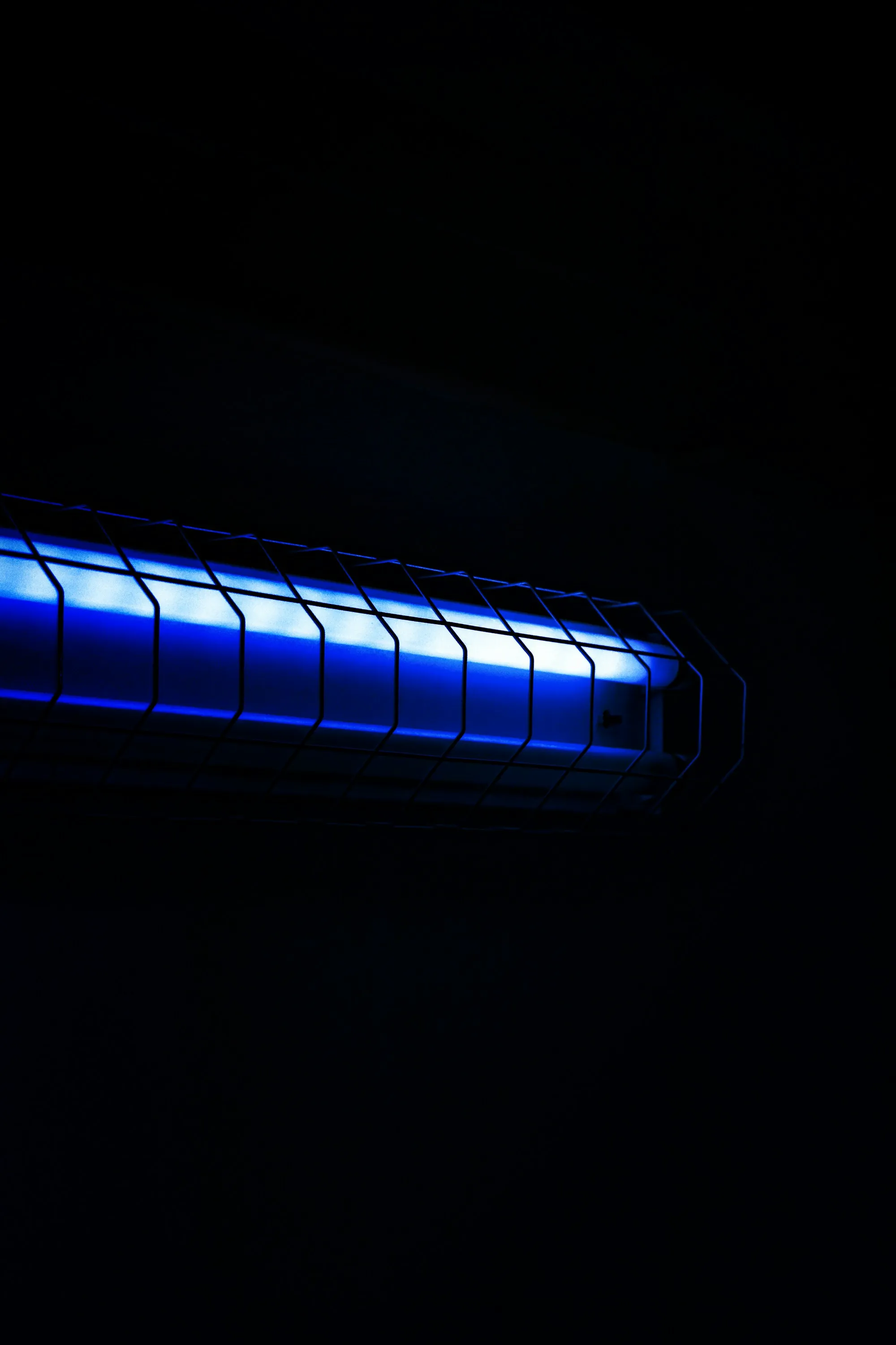 Glowing blue light in a dark room