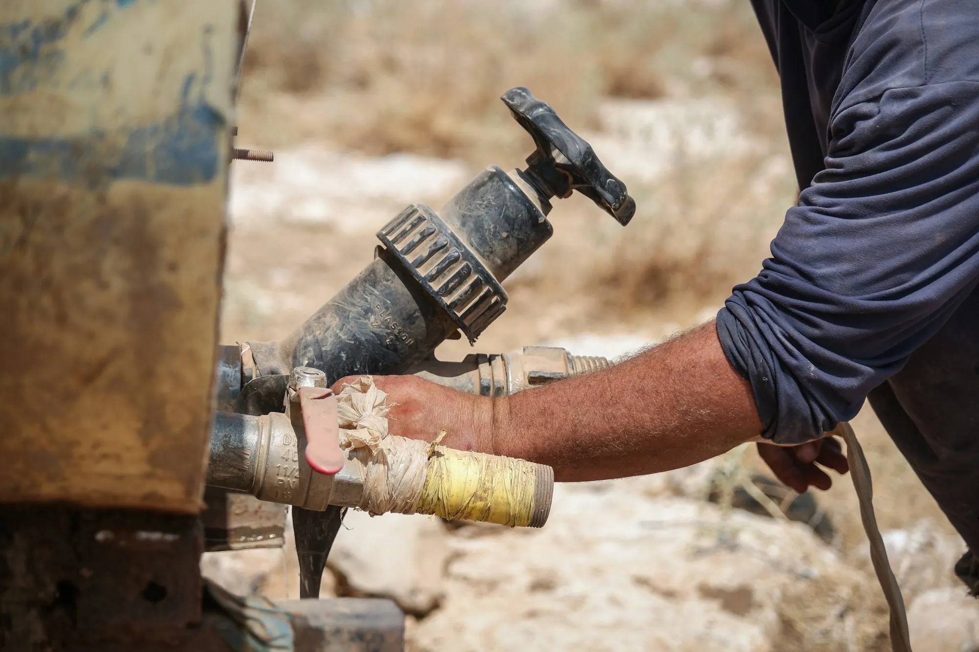 Local Water Specialists Who Test Before They Recommend Person holding a section of pipe
