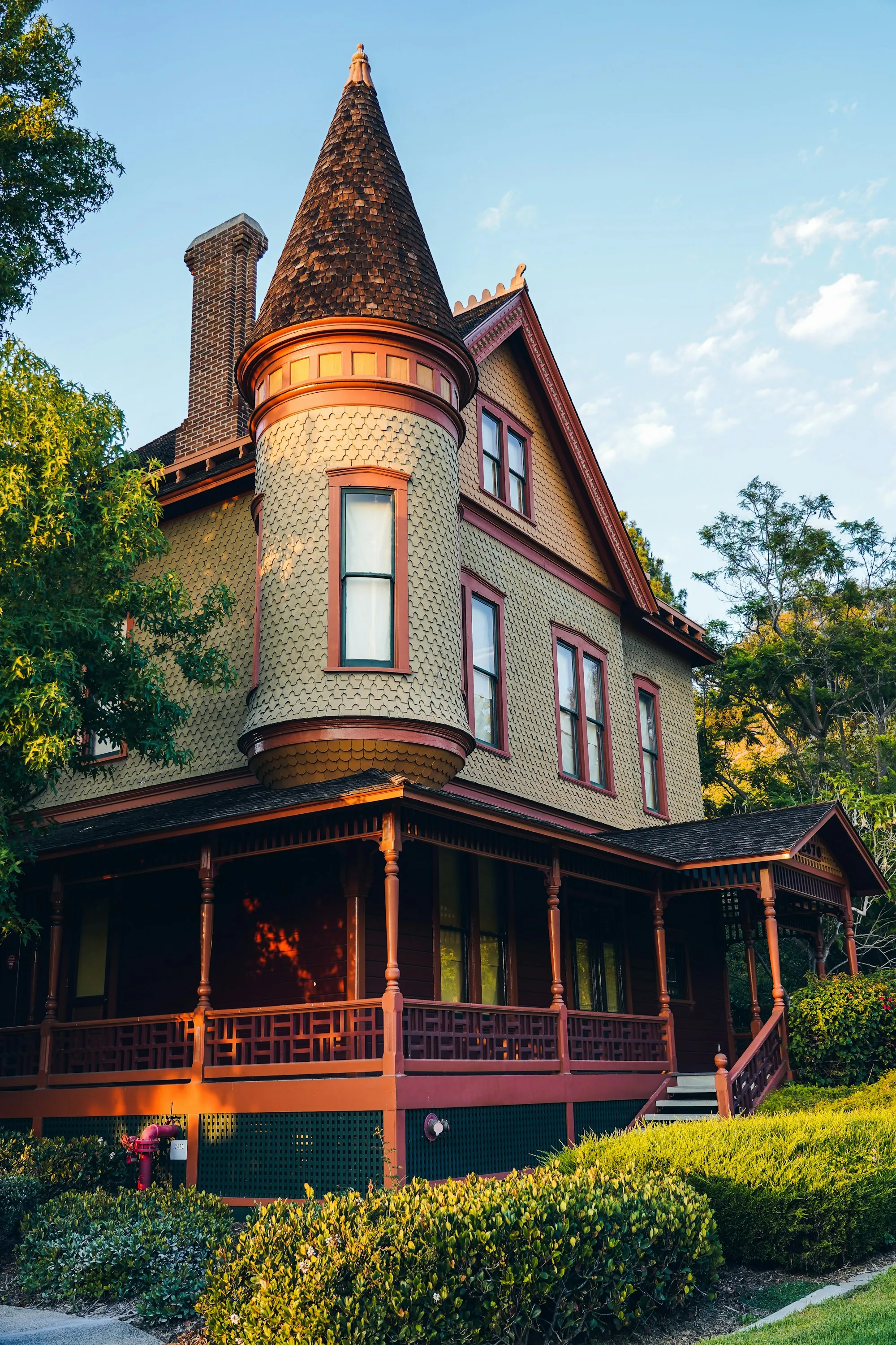 Victorian house with a turret and a wraparound porch