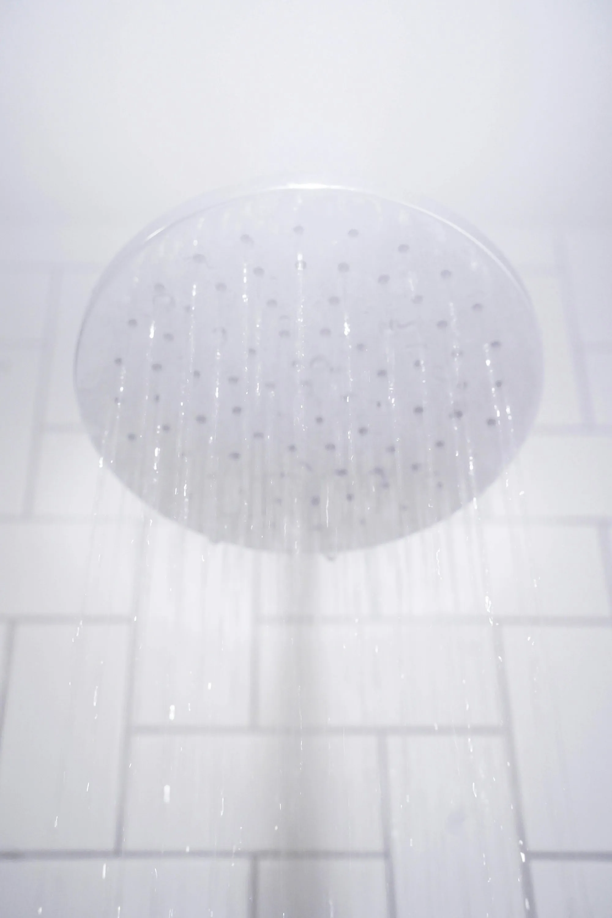 Salt-Free Water Conditioners in Santa Ana Water spraying from a round stainless steel shower head