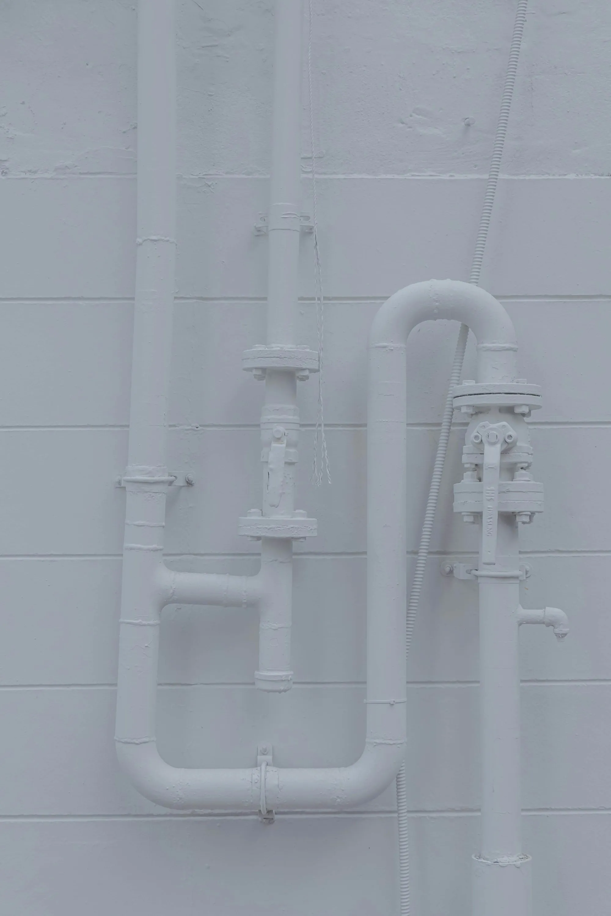 Whole-House Water Filtration in Santa Ana White wall with water pipes running along it
