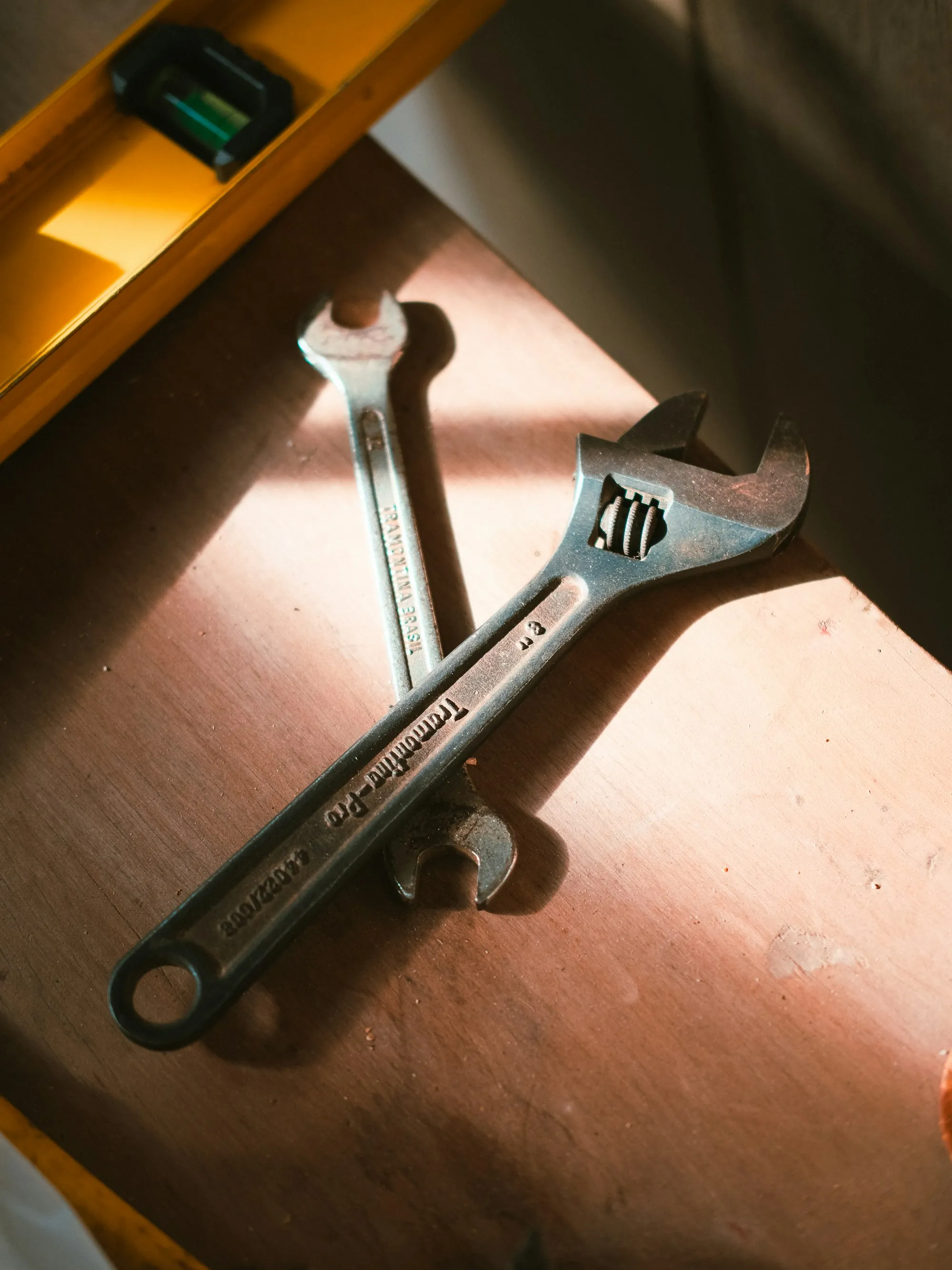 Water Filter Repair & Maintenance in Santa Ana Wrenches and a level on a wooden surface